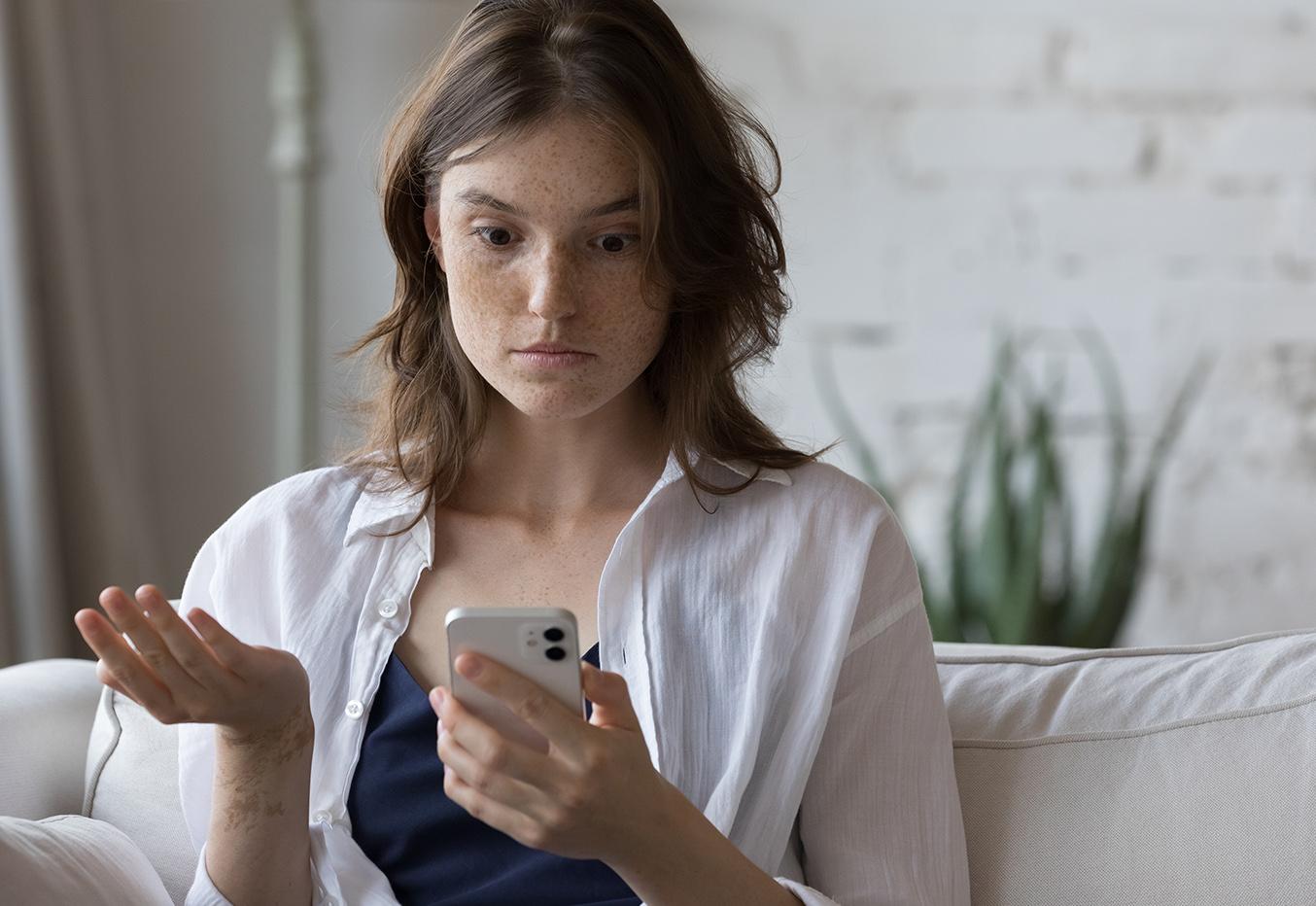 confused girl on cell phone