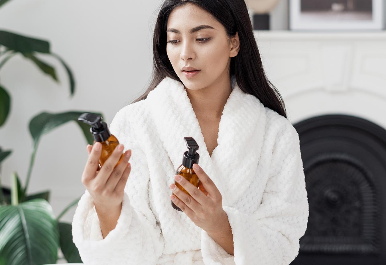 woman looking at skincare