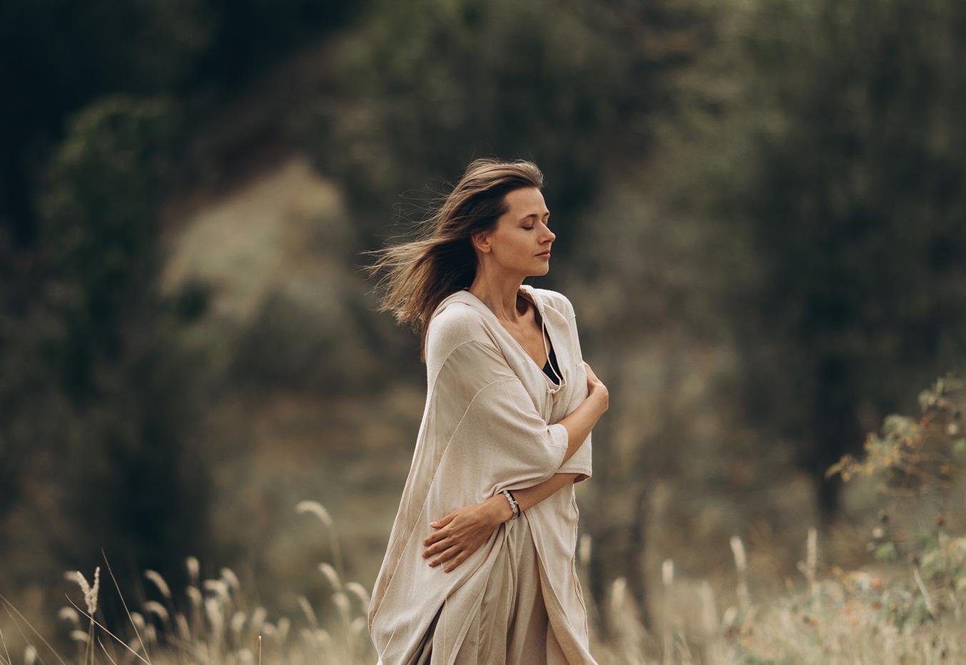 woman relaxing in field